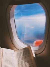 flight plane window reading calm book trust